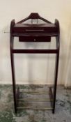 A free standing valet stand with coat hanger, tie pole and storage (H105cm D45cm W45)