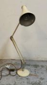 A white Herbert Terry and Sons angle poise desk lamp