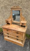 A pine dressing table with mirror back