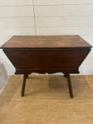 An oak dough bin on turned splayed legs