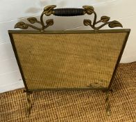 A brass mirrored fire screen (H71cm W45cm)