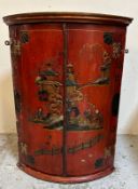 A bow fronted lacquered wall hanging corner cabinet decorated in a rural Japanese scene (H80cm)