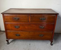 A mahogany low chest of drawers over two long drawers