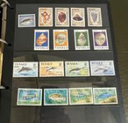 An album of mint UK and South Pacific Marine themed stamps (in sets)