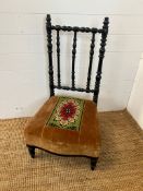 An Elm parlour chair with needlework seat pad