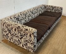 Three seater sofa with pattern fabric and brown cushion seat pads by MOOOI (H60cm W220cm D86cm