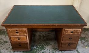 A vintage oak green leather top pedestal desk with six drawers (H73cm D77cm W138cm) Condition Report