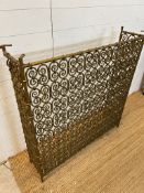 A wrought iron radiator or fire place guard with marble top (H100cm W100cm D25cm)