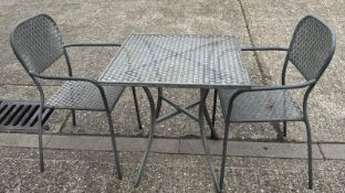 A metal starburst garden table and two chairs (H73cm SQ70cm)