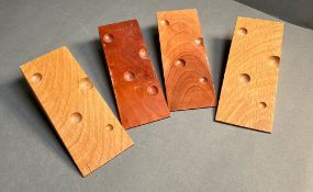 Four David Linley door stops in the form of cheese wedges