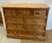 A pine eight drawer chest of drawers (H87cm W101cm D44cm)