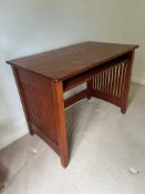 A contemporary desk with slatted sides and pull out shelf (H76cm W101cm D61cm)