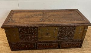 An Omani Zanzibar style chest with brass studded detail and internal candle box (H40cm W96cm D40cm)