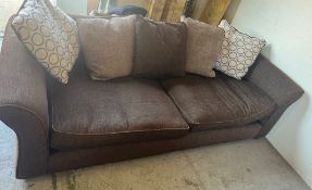 A three seater brown sofa by DFS (H74cm W235cm D100cm SH42cm)
