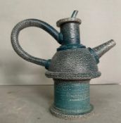 A blue ground studio pottery tea pot on stand
