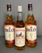 Two bottles of Bells blended Scotch whiskey and a bottle of the famous Grouse