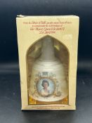 A commemorate porcelain bottle of Bells whiskey 1986