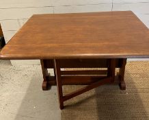A Mid Century drop leaf dining table (H74cm W123cm)