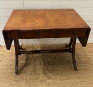 A drop sided sofa table with twin stretcher and out splayed legs (H74cm W94cm D61cm)