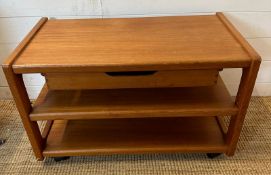 A Mid Century coffee table on castors with two shelves and drawer under