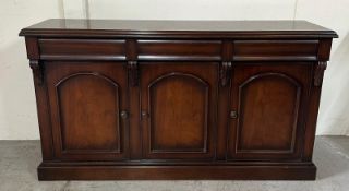 A mahogany sideboard comprising of three drawers and three cupboards under (H92cm W163cm D47cm)