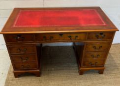 A pedestal desk with ed leather top (H75cm W120cm D60cm)
