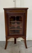 A mahogany glazed corner display cabinet on tripod legs with a scrolling inlay (H110cm W59cm D30cm)