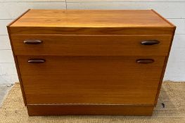 A Mid Century record unit, one long drawer over hinged record cabinet
