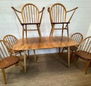 A blonde Ercol Windsor extendable dining table with six matching chairs 180 x 90cm table