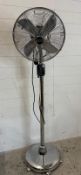A retro electric free standing fan by Freud on castors