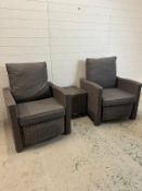 Two Kettler reclining garden loungers in a slate grey rattan