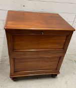 A side cabinet with pull down door on bun feet (H75cm W62cm D50cm)