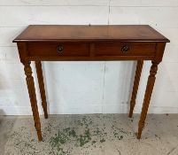 A small console or hall table on fluted legs with a string inlay (H76cm W76cm D28cm)