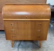 A teak Mid Century roll top bureau with three long drawers under (H96cm W90cm D45cm)