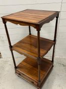 A mahogany three tier wotnot with drawer to base and ring pull handles (H107cm Sq51cm)
