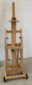 A folding artist easel on wheels by Meeden (H160cm)