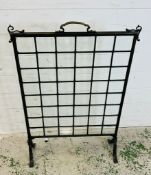 A glass panel fire screen 60cm x 84cm