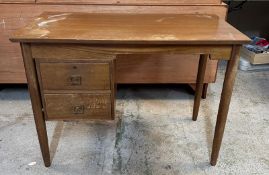 A Mid Century two drawer desk (H71cm W99cm D53cm)