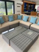 An Indian ocean modular garden lounge set in a rattan grey with beige cushions, comprising of