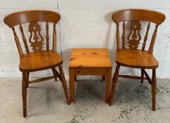 A pine side table and two pine farmhouse chairs