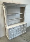 A large white painted Welsh style dresser, with two shelves and a base unit of cupboards and drawers