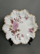 A Lanternier of Limoges scalloped edged serving dish, floral decoration and approximate diameter