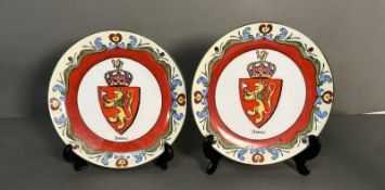 Two china plates with the Norweigan national lion and floral design.