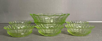 A set of five Vintage green glass dessert bowls and one serving bowl.