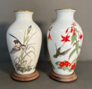 Two Franklin porcelain vases on plinths 