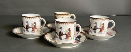 Four Paragon coffee cans and saucers in a floral bird pattern