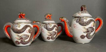 A three piece Chinese dragon themed china tea service