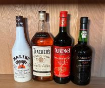 Four bottles of spirits a Teachers whisky, a Malibu, a Dubonnet and a Cockburns Special Reserve