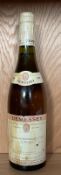 A bottle of Demessey Chassagne Montrachet Premier Cru 1996