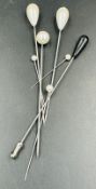 A small selection of seven hat pins.